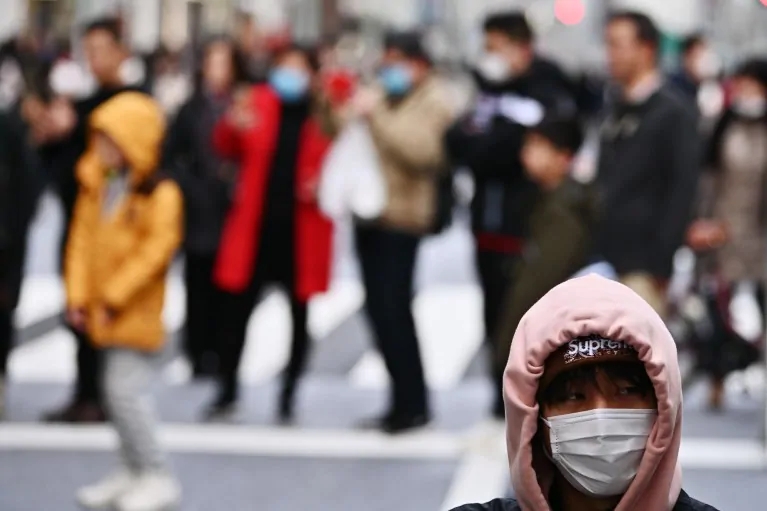A man wearing a protective mask in Tokyo on Saturday.
