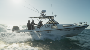 A photo of a speedboat with the WIldAid logo on the side