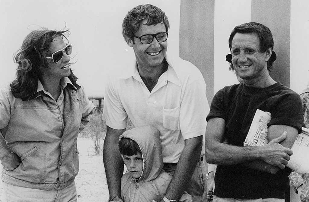 Wendy Benchley (left), Peter Benchley (center), and their son Clayton on the set of Jaws with actor Roy Scheider (right).